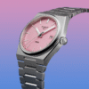 Elegant silver wristwatch with a pink dial and metal band.