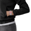 Person wearing a black sweatshirt and a pink wristwatch.