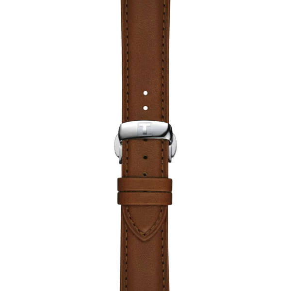 Close-up of a brown leather watch strap with a silver buckle on a matching brown background.