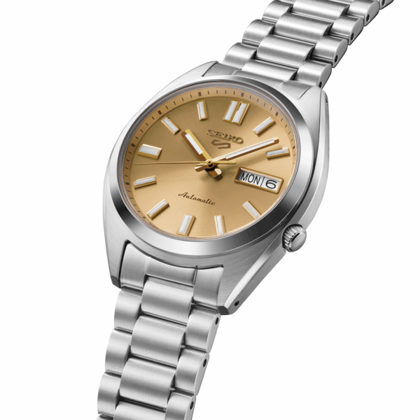 Elegant silver wristwatch with a gold-toned dial and date display.