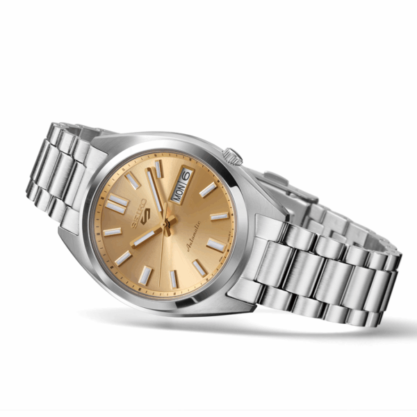 Silver wristwatch with a gold-toned face and metal band.