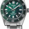 Close-up of a green Seiko dive watch with stainless steel bracelet.