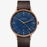 Elegant watch with a blue dial and brown leather strap.